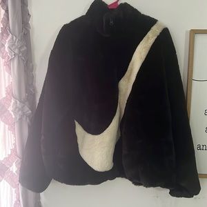 Black Nike zip up fur jacket. Never worn.